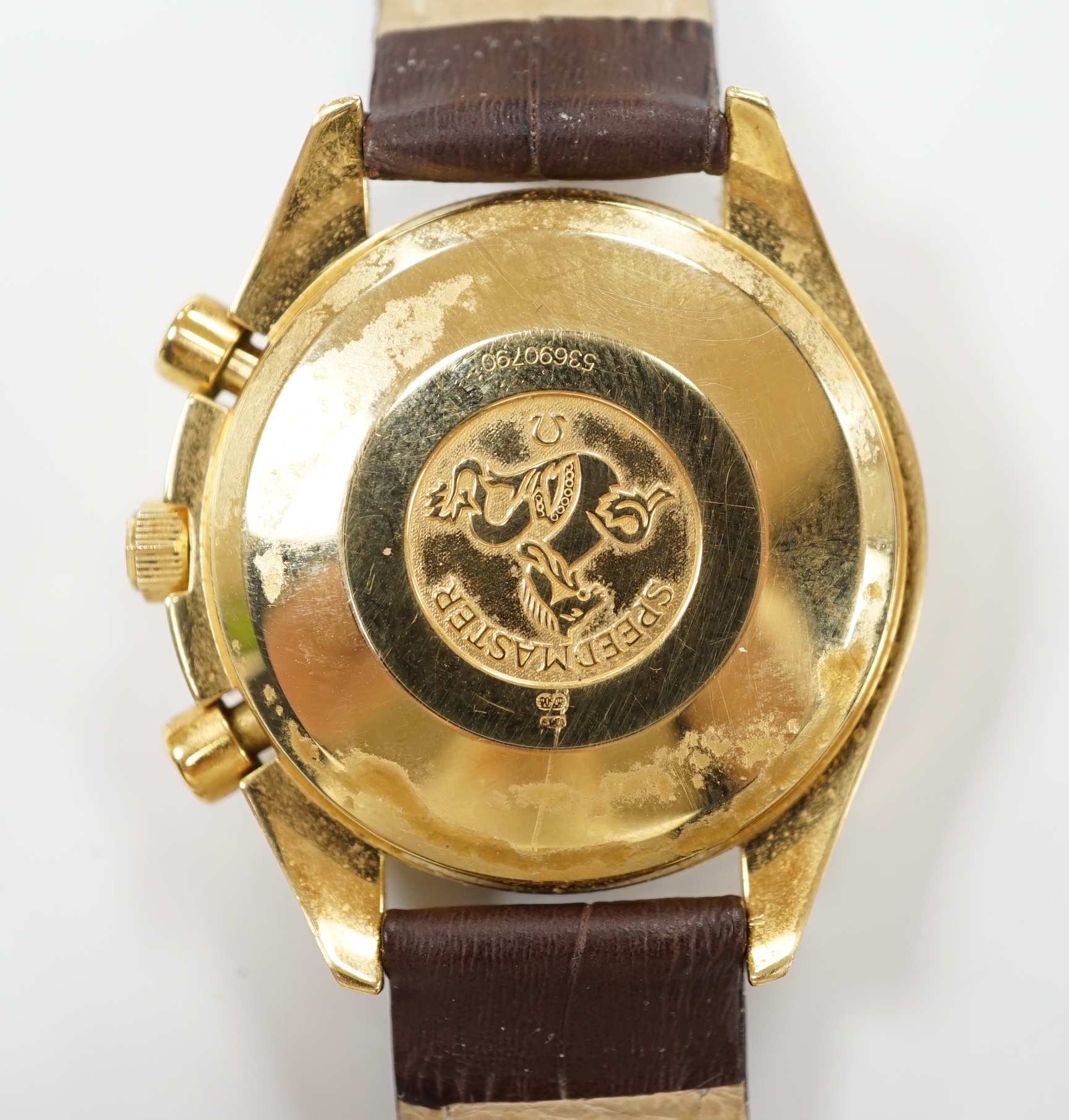 A gentleman's early 1990's 18ct gold Omega Speedmaster automatic wrist watch, with three subsidiary dials, ref. 1155, on later associated leather strap, with gold plated Omega buckle, with box and receipt (second hand).